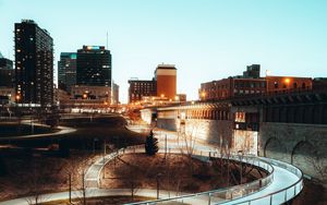 Preview wallpaper city, road, turn, buildings, twilight