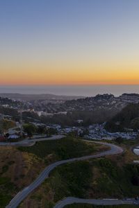 Preview wallpaper city, road, winding, horizon, evening