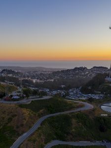 Preview wallpaper city, road, winding, horizon, evening