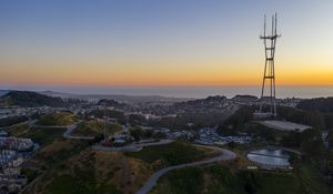 Preview wallpaper city, road, winding, horizon, evening