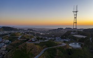 Preview wallpaper city, road, winding, horizon, evening