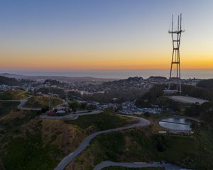 Preview wallpaper city, road, winding, horizon, evening