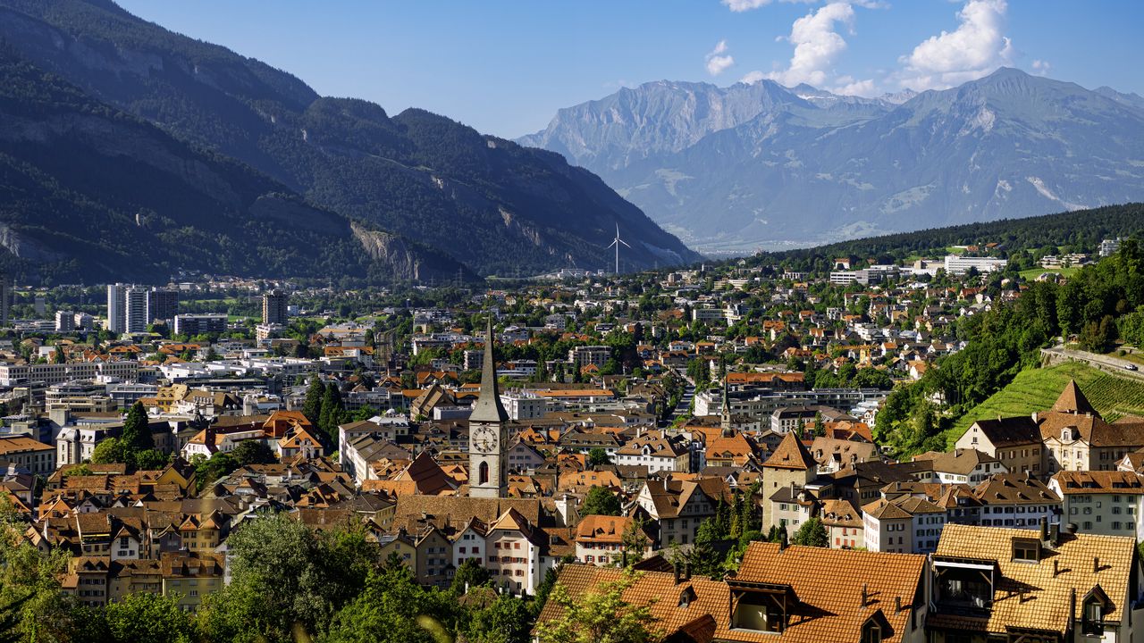 Wallpaper city, roofs, sky, mountains, clouds