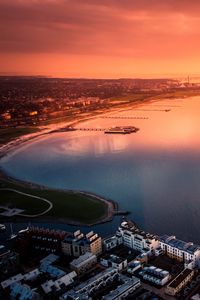 Preview wallpaper city, sea, aerial view, coast, sunset