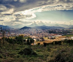 Preview wallpaper city, sky, nature, top view, grass, clouds