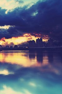 Preview wallpaper city, skyline, river, buildings, clouds