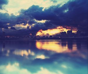 Preview wallpaper city, skyline, river, buildings, clouds