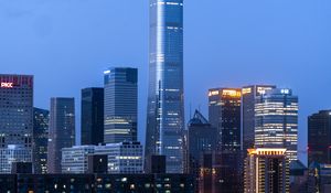 Preview wallpaper city, skyscraper, buildings, lights, twilight