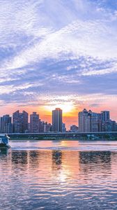 Preview wallpaper city, skyscrapers, architecture, sea, sunset