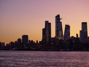 Preview wallpaper city, skyscrapers, architecture, sea, evening