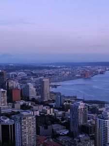 Preview wallpaper city, skyscrapers, architecture, evening, buildings, coast