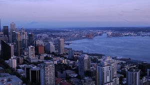 Preview wallpaper city, skyscrapers, architecture, evening, buildings, coast