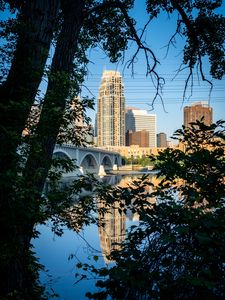 Preview wallpaper city, skyscrapers, bridge, river, reflection, trees, architecture