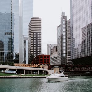 Preview wallpaper city, skyscrapers, buildings, boat, coast