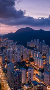 Preview wallpaper city, skyscrapers, buildings, evening, mountains