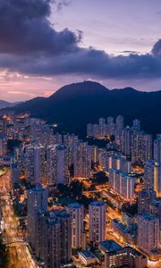 Preview wallpaper city, skyscrapers, buildings, evening, mountains