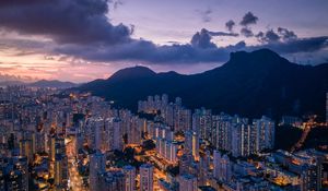 Preview wallpaper city, skyscrapers, buildings, evening, mountains