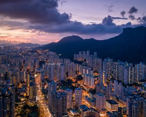 Preview wallpaper city, skyscrapers, buildings, evening, mountains