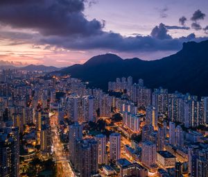 Preview wallpaper city, skyscrapers, buildings, evening, mountains