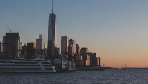 Preview wallpaper city, skyscrapers, pier, water, twilight