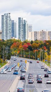 Preview wallpaper city, skyscrapers, road, cars, architecture, trees