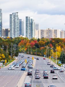 Preview wallpaper city, skyscrapers, road, cars, architecture, trees