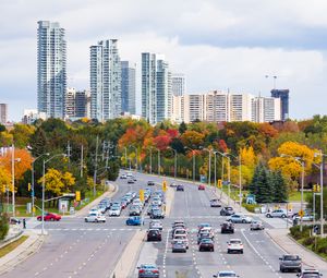 Preview wallpaper city, skyscrapers, road, cars, architecture, trees