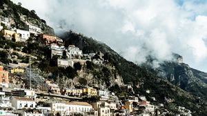 Preview wallpaper city, slope, houses, fog