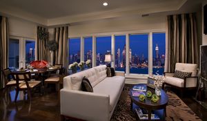 Preview wallpaper city, sofa, buildings, interiors, apartment, room, suite, metropolis, skyscrapers, night, new york, window, penthouse, table, usa