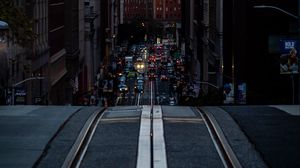 Preview wallpaper city, street, hill, rails, buildings, cars