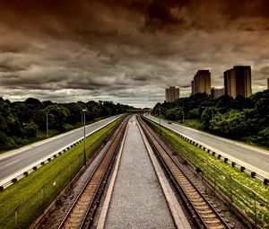 Preview wallpaper city, street, sky, houses, railway