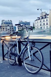 Preview wallpaper city, sunrise, street, building, road, bike, fog