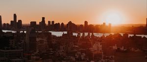 Preview wallpaper city, sunset, aerial view, buildings, sun