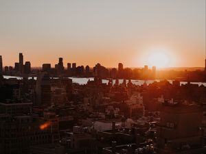 Preview wallpaper city, sunset, aerial view, buildings, sun