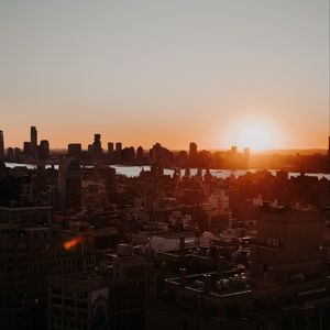 Preview wallpaper city, sunset, aerial view, buildings, sun