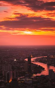 Preview wallpaper city, sunset, aerial view, buildings, river, dusk