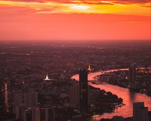 Preview wallpaper city, sunset, aerial view, buildings, river, dusk