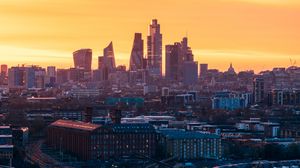 Preview wallpaper city, sunset, aerial view, buildings, architecture