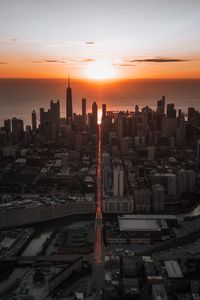 Preview wallpaper city, sunset, aerial view, buildings, sea, coast