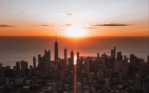 Preview wallpaper city, sunset, aerial view, buildings, sea, coast