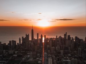 Preview wallpaper city, sunset, aerial view, buildings, sea, coast
