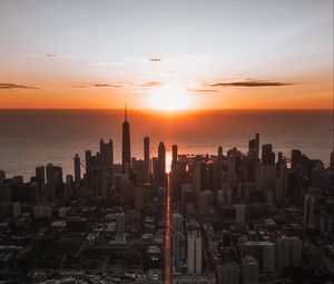 Preview wallpaper city, sunset, aerial view, buildings, sea, coast