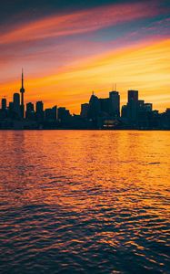 Preview wallpaper city, sunset, evening, water