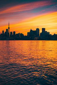 Preview wallpaper city, sunset, evening, water