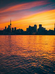 Preview wallpaper city, sunset, evening, water