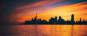 Preview wallpaper city, sunset, evening, water