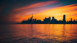 Preview wallpaper city, sunset, evening, water