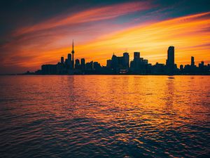 Preview wallpaper city, sunset, evening, water