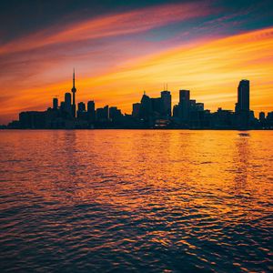 Preview wallpaper city, sunset, evening, water