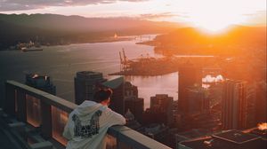 Preview wallpaper city, sunset, loneliness, man, solitude